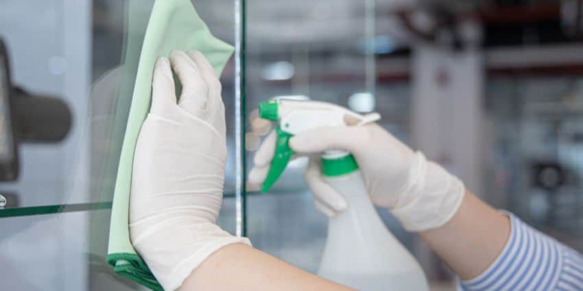 Professional cleaning team deep cleaning office workspace